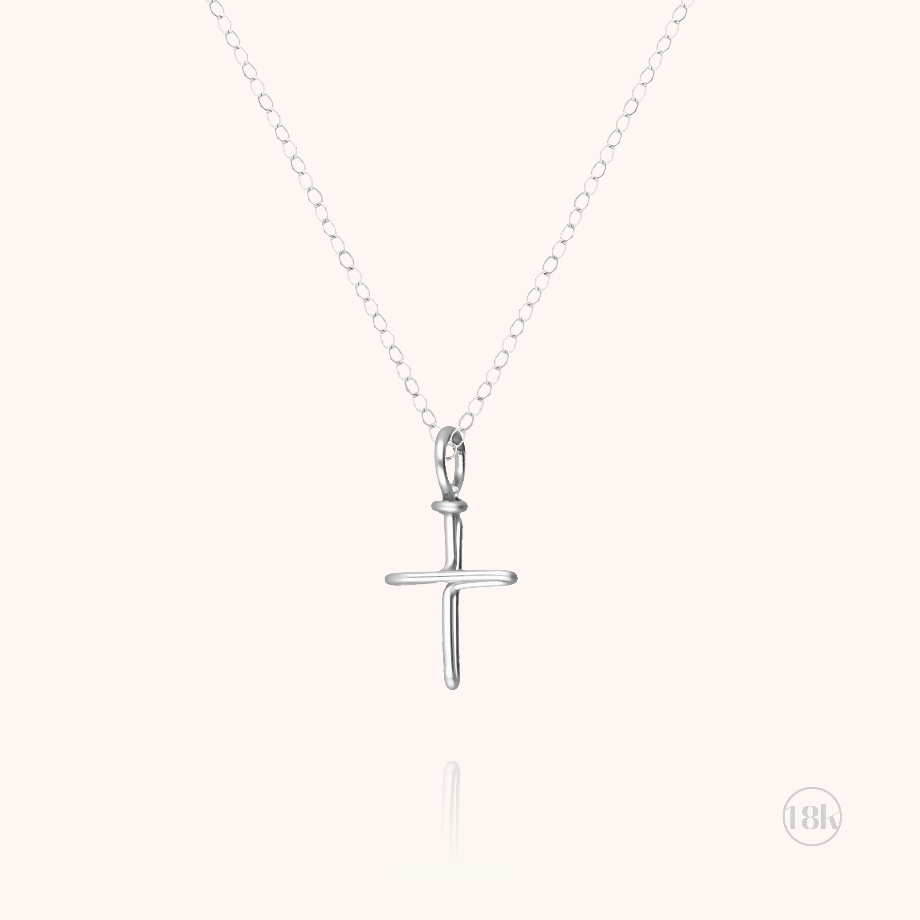 Collier Charms Symbolic Croix en or blanc 750/1000 avec pampille croix argent sterling